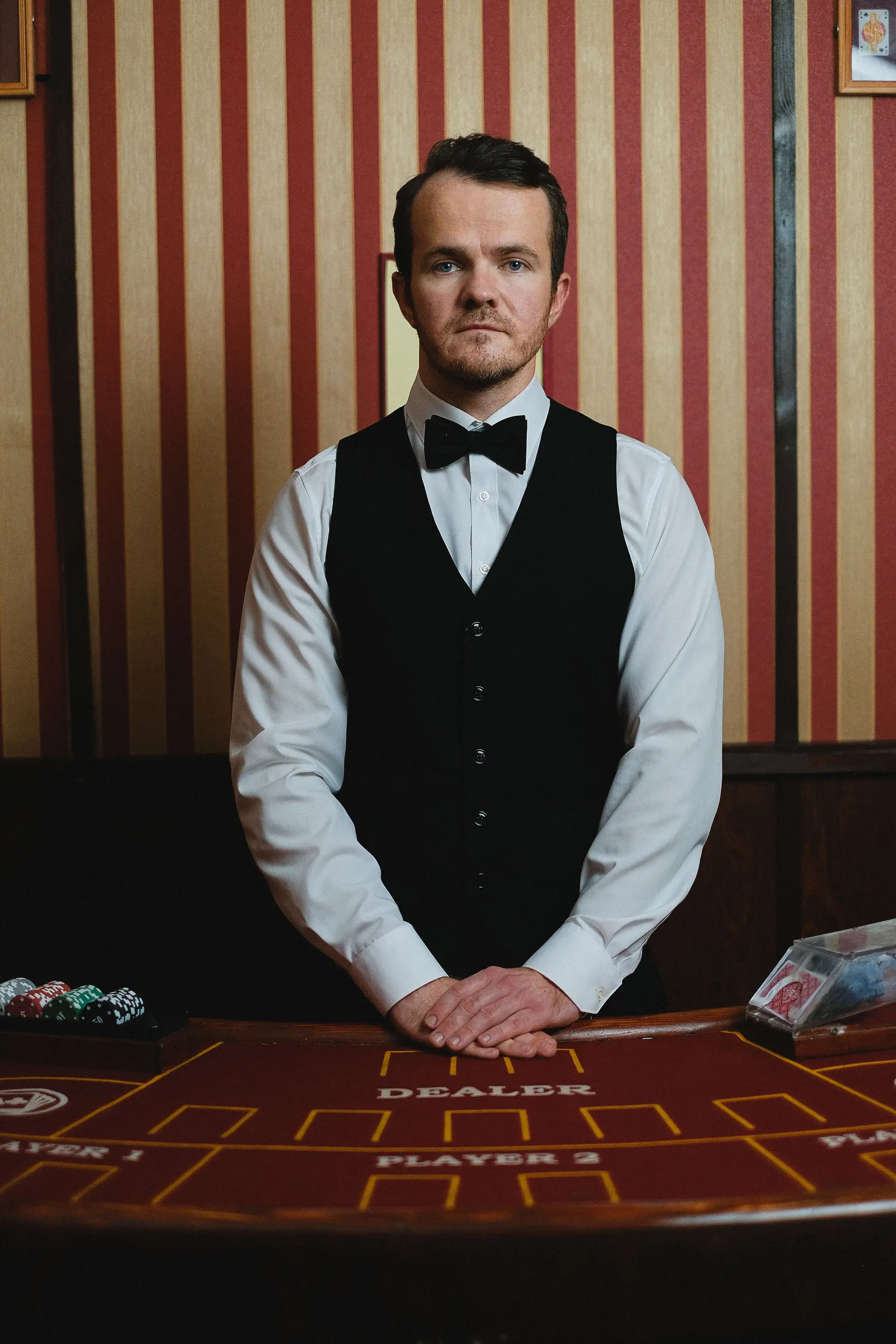 Casino croupier at table